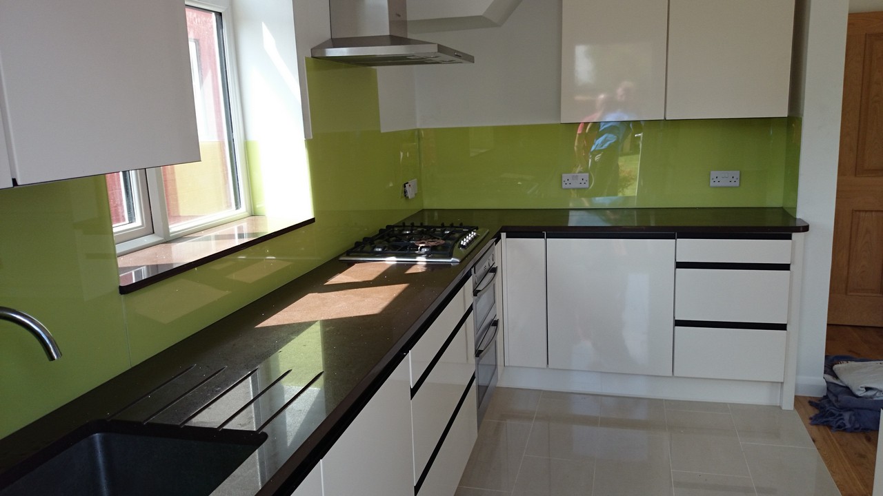Lime green glass kitchen splashback installed by West Kensington glaziers